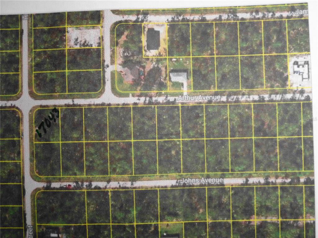 This is an aerial map showing a grid of undeveloped land parcels and streets — 17043 ARTHUR AVENUE, PORT CHARLOTTE, FL