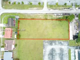 An aerial view shows a rectangular vacant lot outlined in red — 1855 NW 119th St, Miami FL 33167, MIAMI, FL