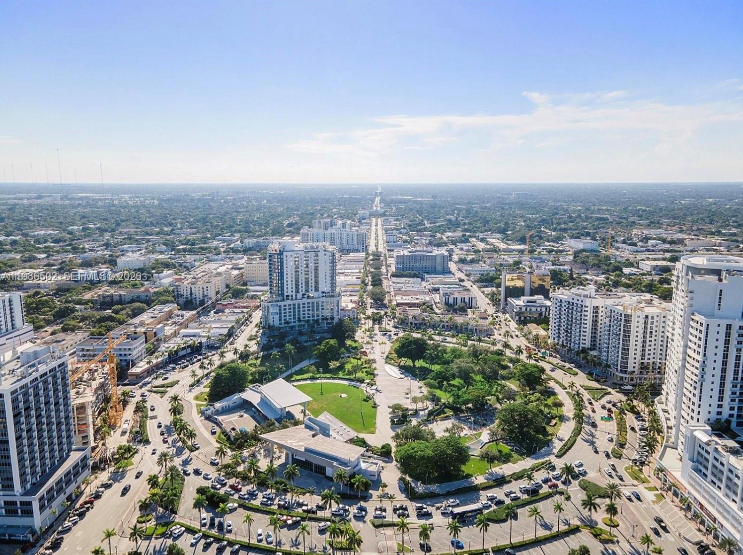 An aerial view shows a city park surrounded by high-rise buildings and urban streets — 1830 Radius Dr # 522, Hollywood FL 33020, HOLLYWOOD, FL