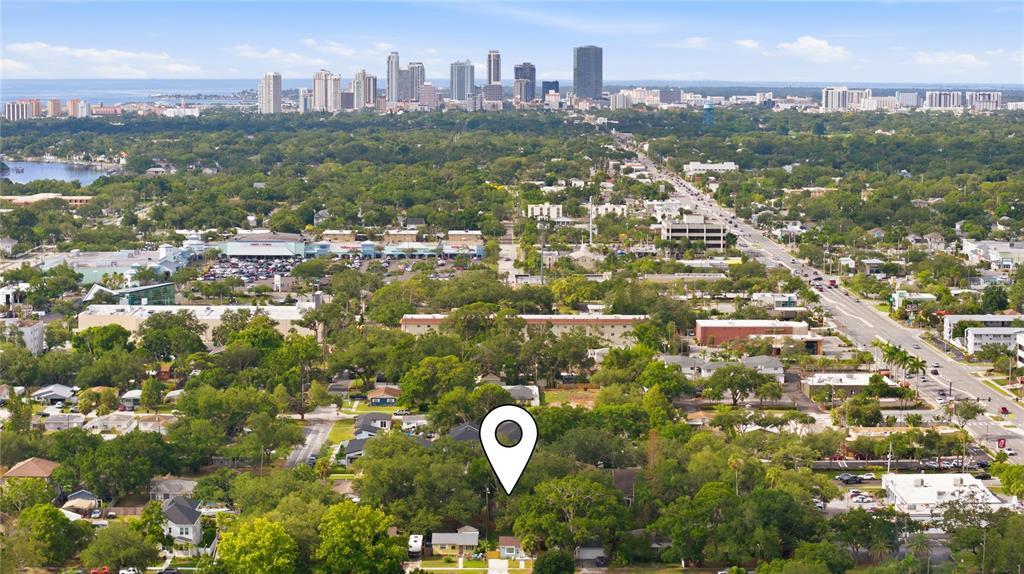 An aerial view shows a residential property marked with a pin near a city skyline — 331 43RD AVENUE N, ST PETERSBURG, FL