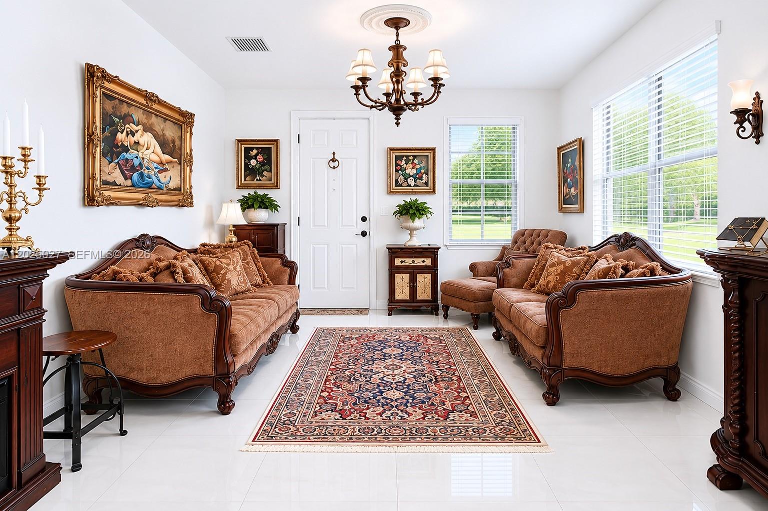 A formal living room features two brown sofas, a patterned area rug, and a chandelier — 19220 NE 9th Pl, Miami FL 33179, MIAMI, FL