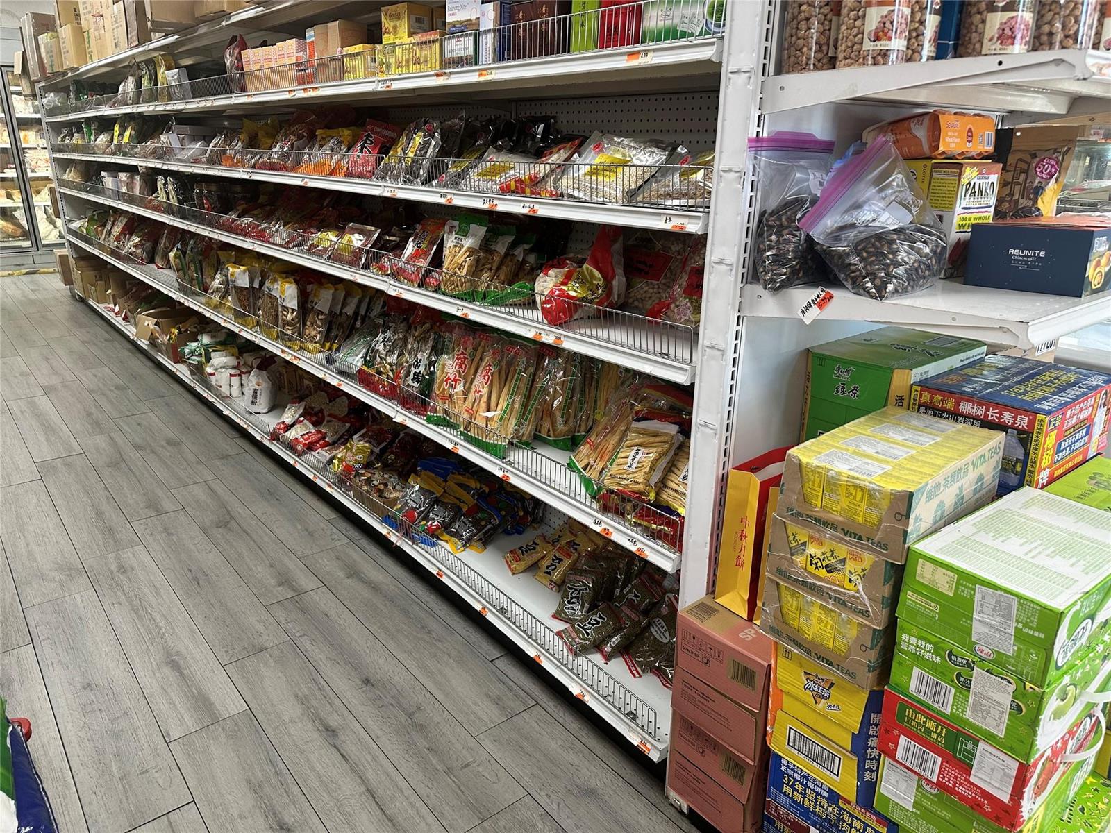 Shelves in a grocery store are stocked with various packaged food items and beverages — 2518 N State Rd, Hollywood FL 33021, HOLLYWOOD, FL