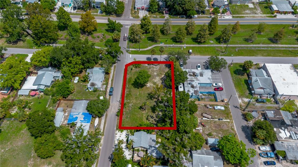 An aerial view shows a vacant rectangular lot outlined in red between two paved streets — 5020 TANGERINE AVENUE S, GULFPORT, FL