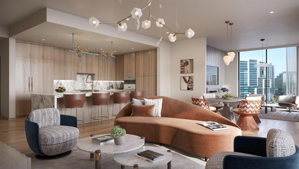 This rendering shows an open-concept living area with a curved sofa, kitchen island, and dining space — 550 GOLDEN GATE POINT UNIT 201, SARASOTA, FL