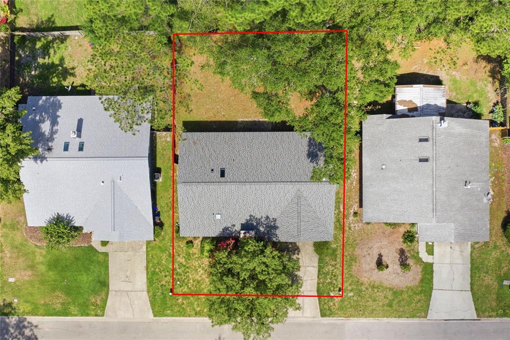 An aerial view shows a single-family home with a gray roof and a fenced backyard — 6438 NW 37TH TERRACE, GAINESVILLE, FL
