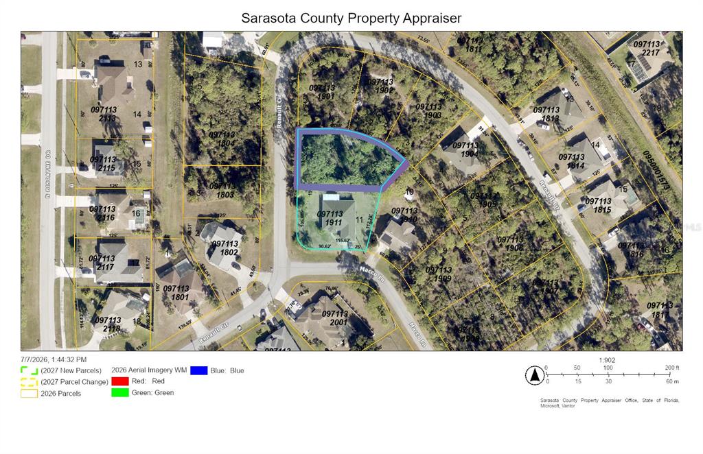 A view of a wooded, undeveloped residential lot from the edge of an asphalt road — RENAULT CIRCLE, NORTH PORT, FL