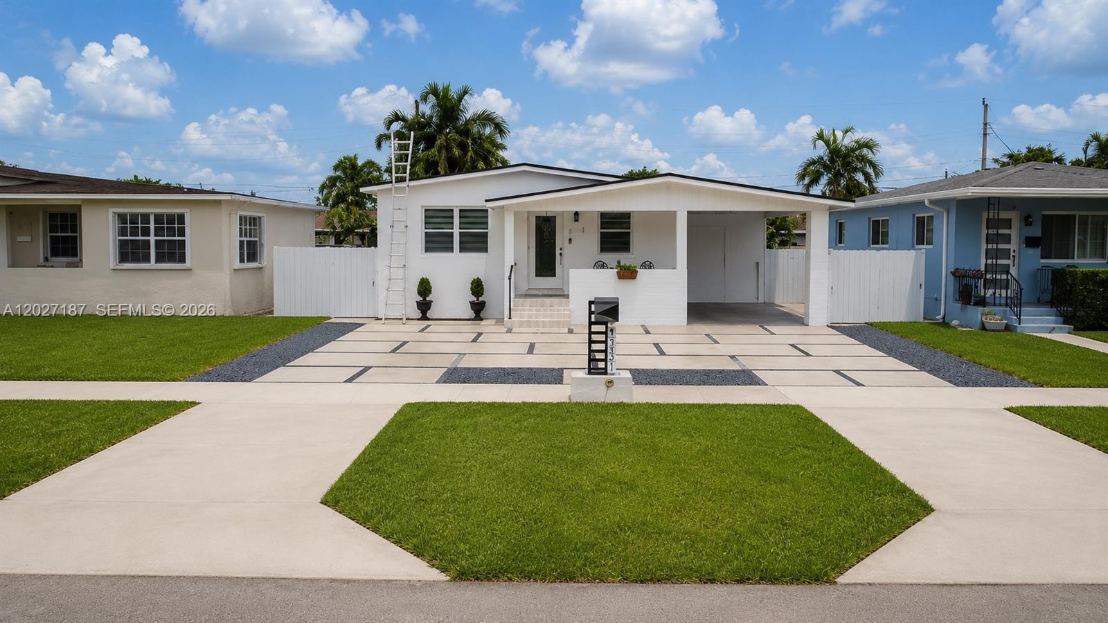 A white single-story house features a modern concrete driveway with dark gravel accents — 6748 SW 38th St, Miami FL 33155, MIAMI, FL
