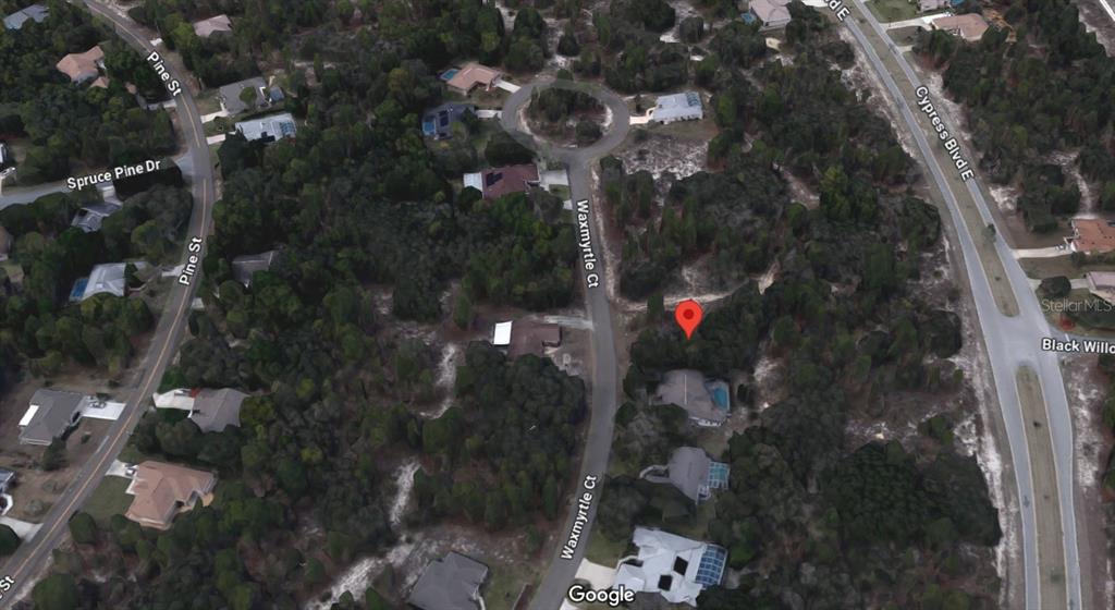 This is an aerial map view of a residential neighborhood with a highlighted property location — 27 WAXMYRTLE COURT, HOMOSASSA, FL