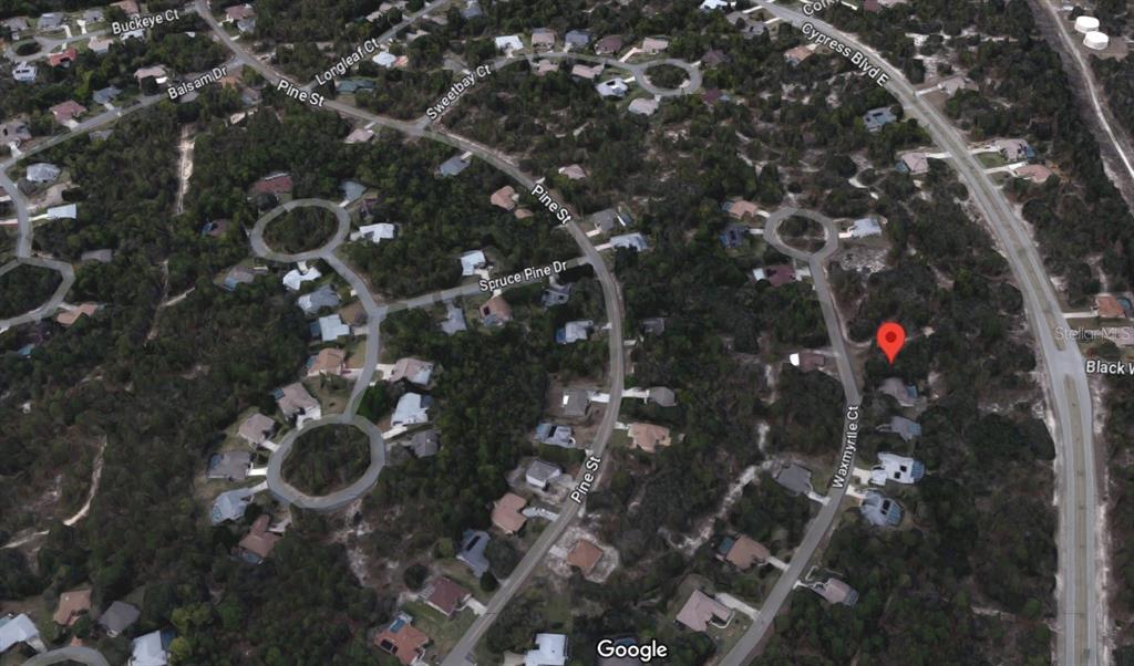 This is a satellite map view of a residential neighborhood with houses and wooded lots — 27 WAXMYRTLE COURT, HOMOSASSA, FL