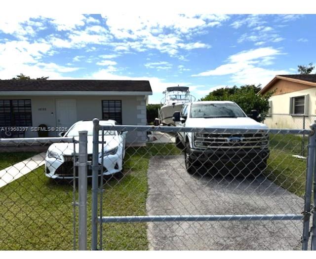 A white car and a white pickup truck are parked in front of a house — 10752 SW 141st Ln, Miami FL 33176, MIAMI, FL