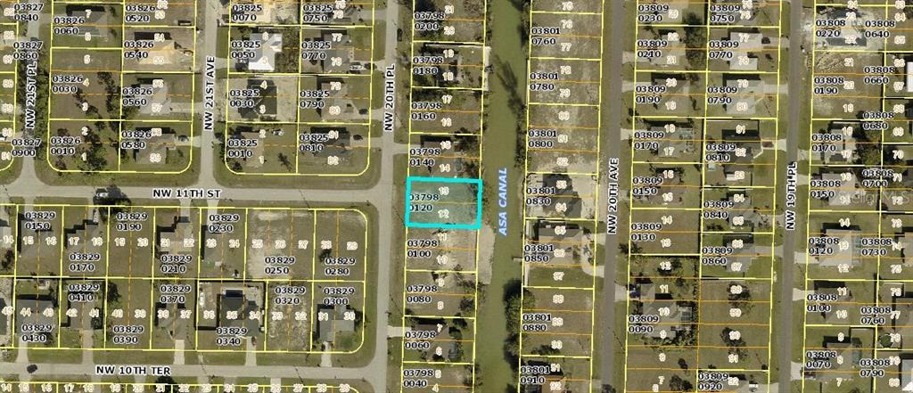 This is a map showing a vacant residential lot highlighted in blue along a canal — 1031 NW 20TH PLACE, CAPE CORAL, FL