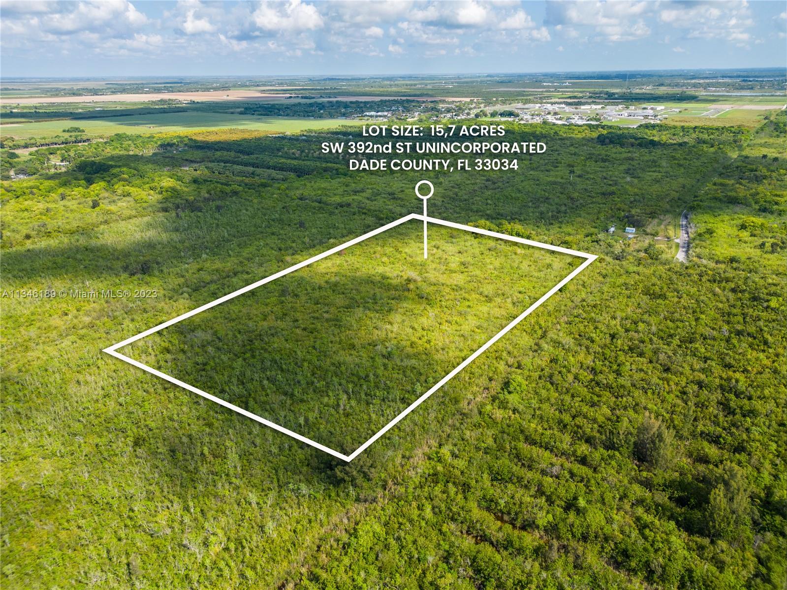 An aerial view shows a large, rectangular plot of undeveloped land covered in dense vegetation — SW 392nd St, Unincorporated Dade County FL 33034, UNINCORPORATED DADE COUNTY, FL