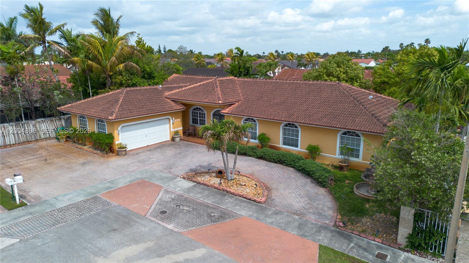 An aerial view shows a single-story house with a tile roof and a circular driveway — 13911 SW 18th Ter, Miami FL 33175, MIAMI, FL
