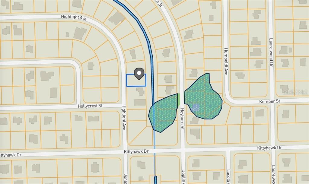 This is a map showing a residential area with a highlighted property and green spaces — 3824 HIGHLIGHT STREET, FORT MYERS, FL