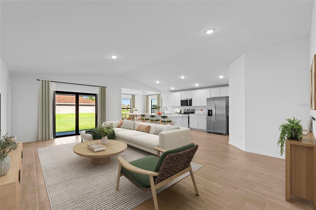 This is a digital rendering of an open-concept living room and kitchen with light flooring — 23145 MCBURNEY AVENUE, PORT CHARLOTTE, FL
