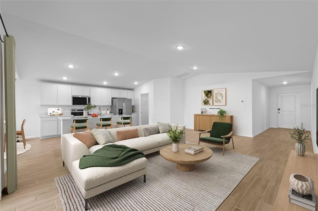 This is a digital rendering of an open-concept living room and kitchen with white cabinetry — 23145 MCBURNEY AVENUE, PORT CHARLOTTE, FL