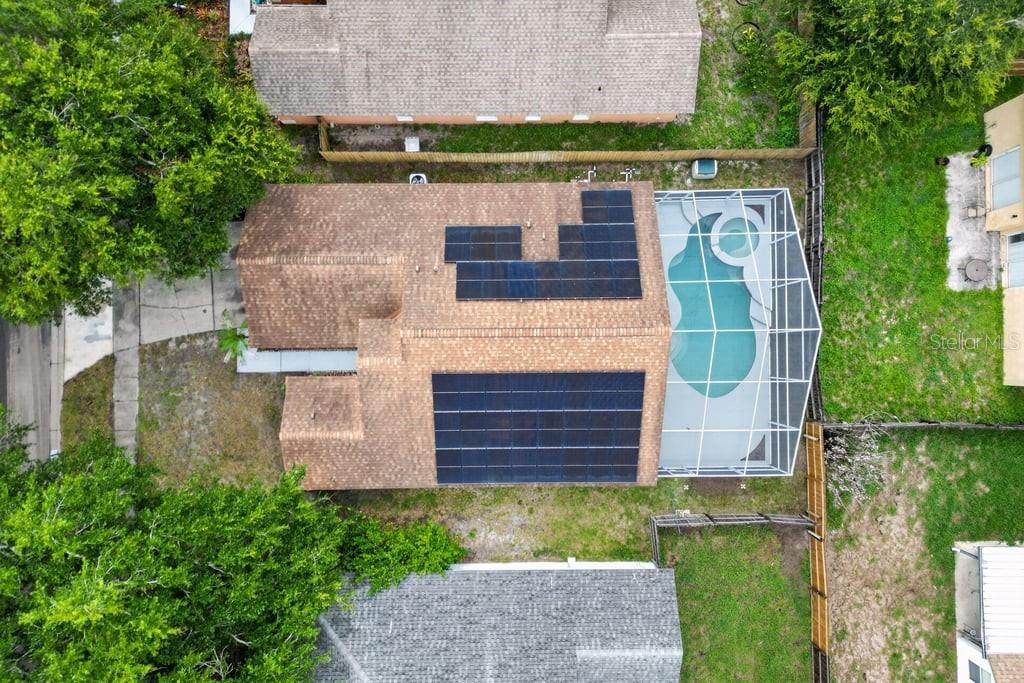 A single-story house with a peach-colored exterior, a two-car garage, and a small front lawn — 97 ABBEY HOLLOW DRIVE, APOPKA, FL