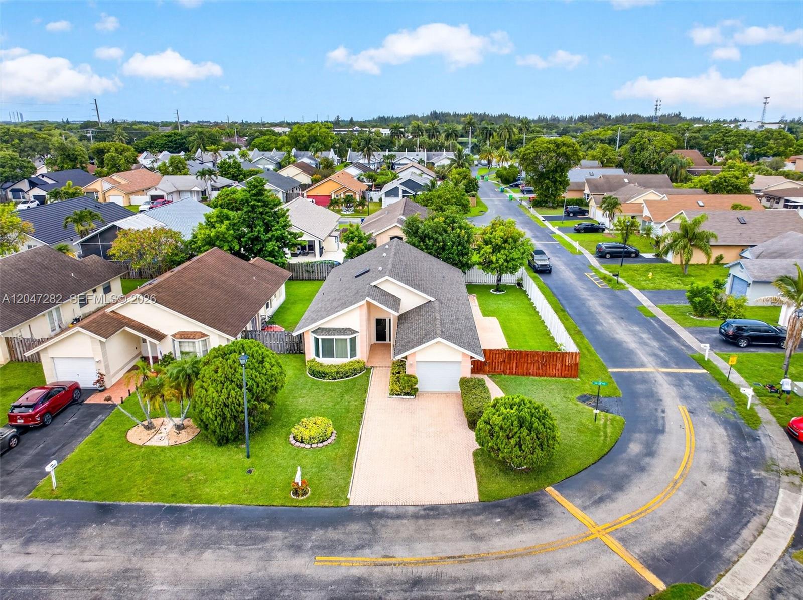 An aerial view shows a suburban house with a paved driveway and lawn — 4495 NW 99th Ave, Sunrise FL 33351, SUNRISE, FL