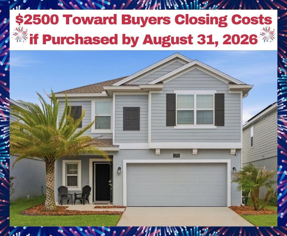 A two-story suburban house with light blue siding, a two-car garage, and a palm tree — 1251 SAND TRAP COURT, DAYTONA BEACH, FL
