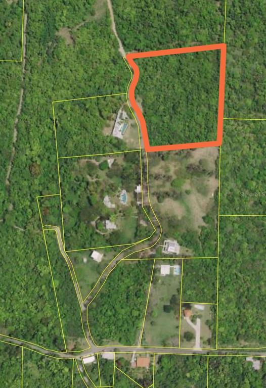 An aerial map view shows a parcel of land outlined in orange — 89 CALLE CASA HIX, VIEQUES, PR