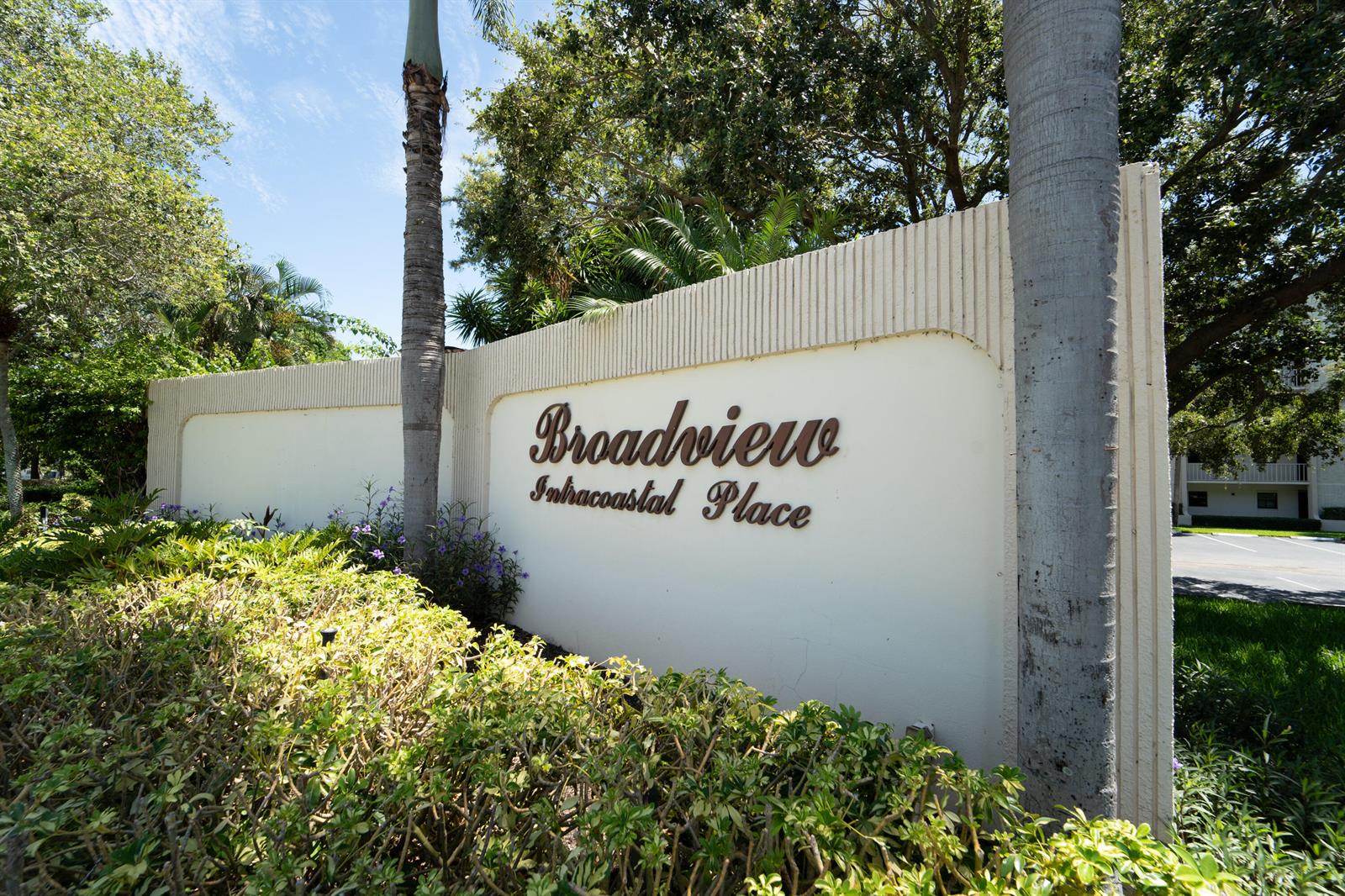 A beige sign with the text Broadview Intracoastal Place stands outdoors surrounded by palm trees — 100 Intracoastal Place # 205, Jupiter FL 33469, JUPITER, FL