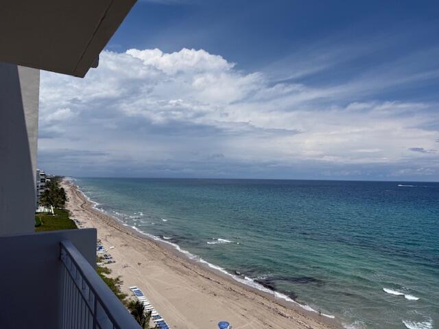 A high-angle view of a sandy beach and ocean from a balcony — 3215 S Ocean Boulevard # 911, Highland Beach FL 33487, HIGHLAND BEACH, FL