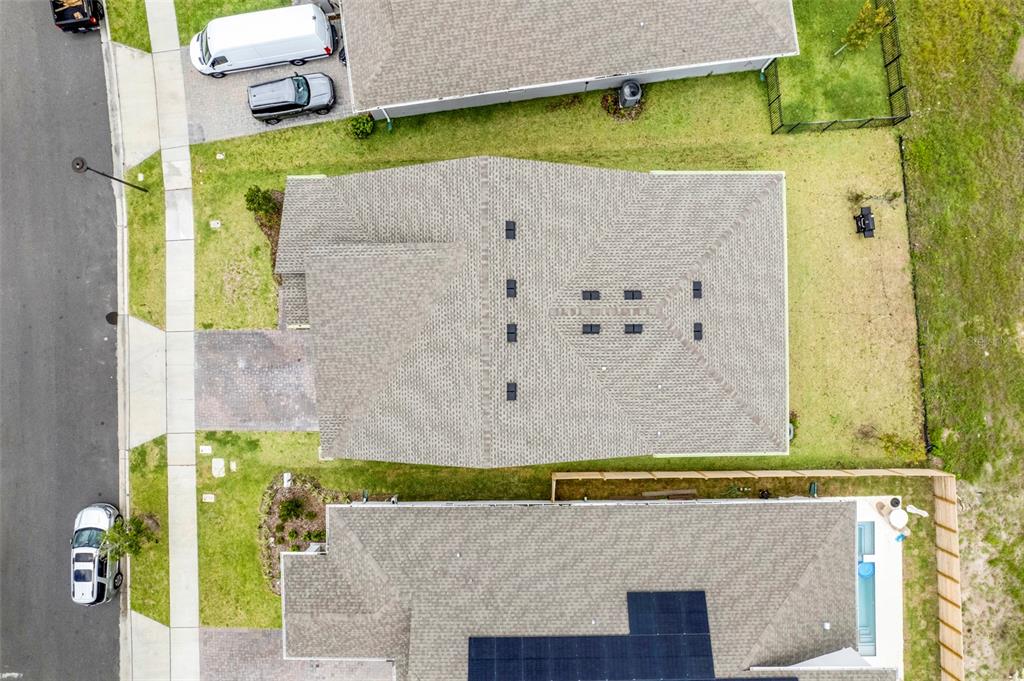 An aerial view shows a residential house with a shingled roof and surrounding yards — 18863 RAWSON STREET, ORLANDO, FL