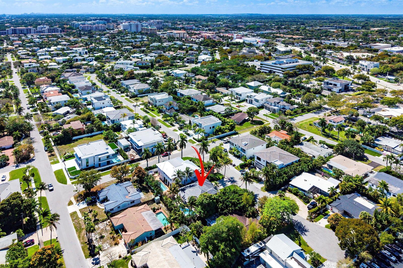 An aerial view of a suburban neighborhood with a red arrow pointing to a house — 1132 NE 3rd Avenue, Boca Raton FL 33432, BOCA RATON, FL