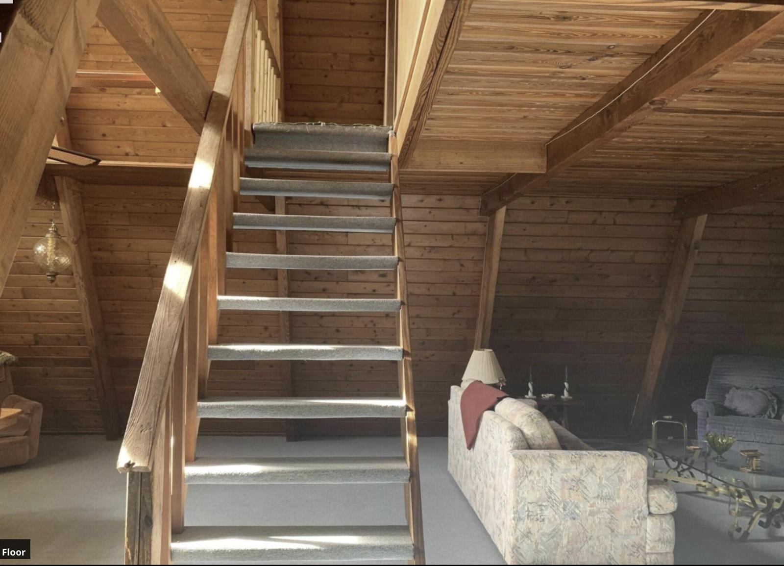A wooden A-frame room features a carpeted staircase leading to a lofted upper level — 31110 U.s. 441, Okeechobee FL 34972, OKEECHOBEE, FL