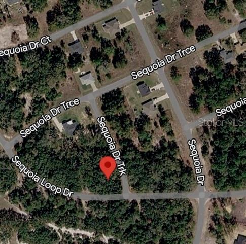 This is an aerial map showing a vacant lot marked with a red pin — SEQUOIA DRIVE Lot 5, OCKLAWAHA, FL