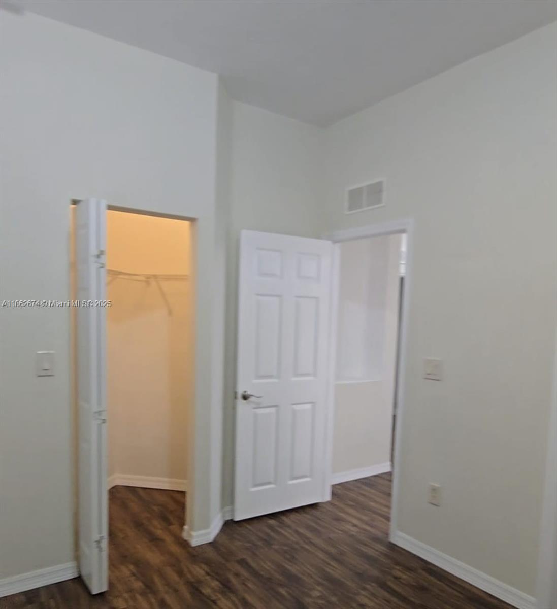 A room features wood-look flooring, a white interior door, and an open closet — 4917 SW 141st Ave # 4, Miramar FL 33027, MIRAMAR, FL