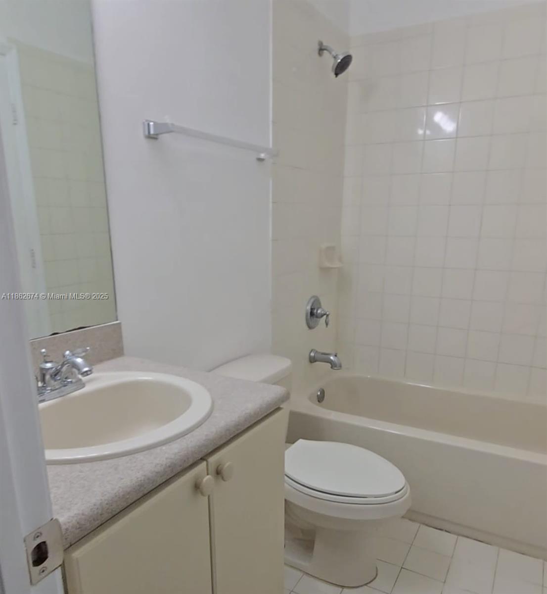A bathroom features a vanity with a sink, a toilet, and a tiled shower-tub combination — 4917 SW 141st Ave # 4, Miramar FL 33027, MIRAMAR, FL