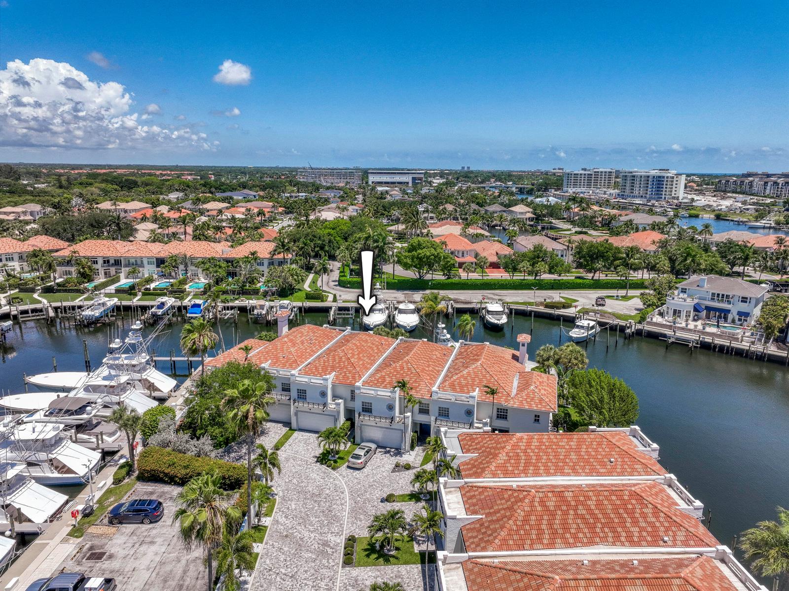 An aerial view shows a waterfront townhouse complex with a private boat dock — 2245 Monet Road, North Palm Beach FL 33410, NORTH PALM BEACH, FL