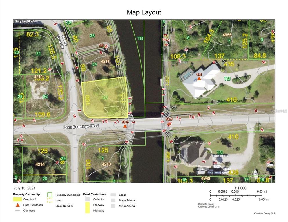 This is a map showing a vacant lot highlighted in yellow near a canal — 14270 SAN DOMINGO BOULEVARD, PORT CHARLOTTE, FL