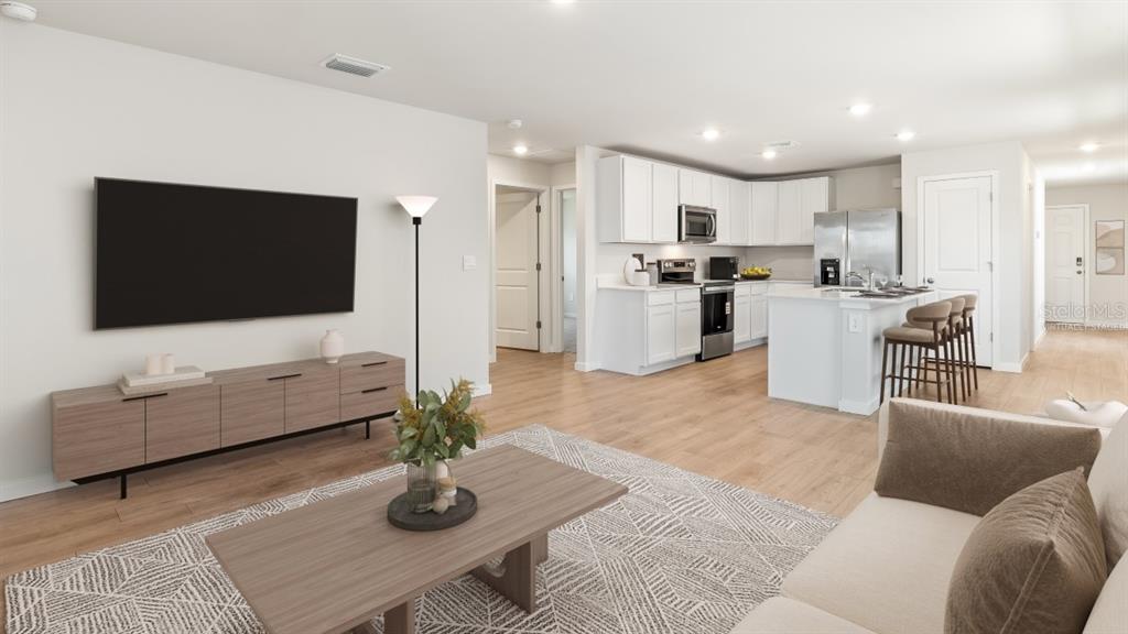 This is a virtual staging rendering of an open-concept living room and kitchen area — 1468 HARMON DRIVE, PORT CHARLOTTE, FL