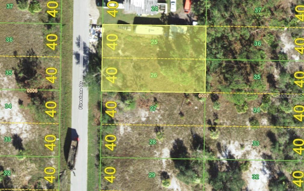 This is a map showing two adjacent land parcels highlighted in yellow along a road — 2354 FIRESTONE DRIVE, PUNTA GORDA, FL