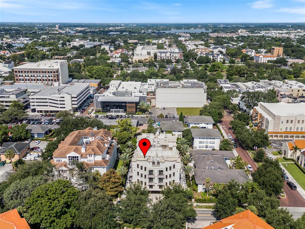 An aerial view shows a multi-story apartment building marked with a red location pin — 125 S INTERLACHEN AVENUE UNIT 1, WINTER PARK, FL
