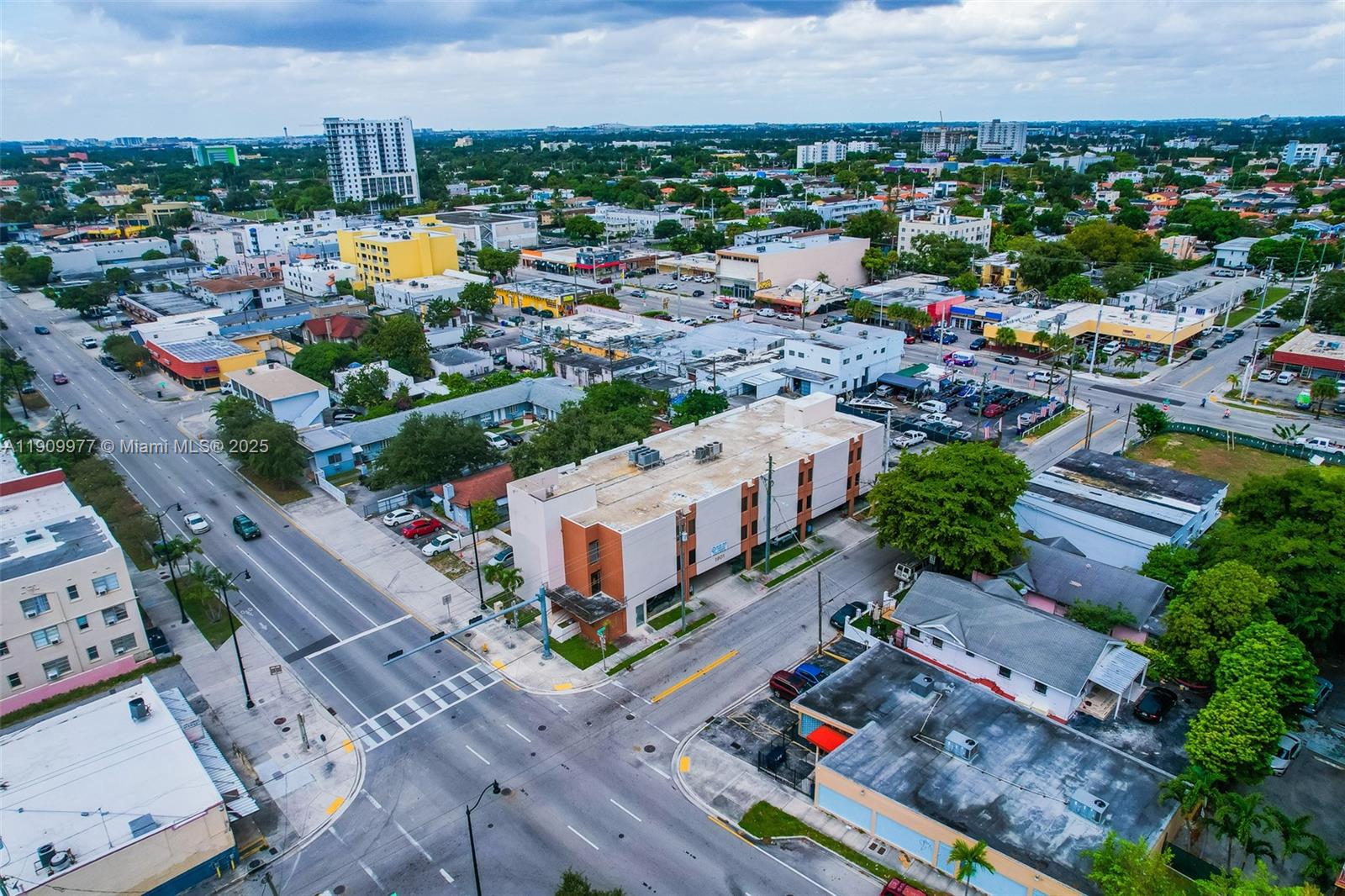 An aerial view shows a multi-story commercial building at a street intersection in a city — 1901 SW 1st St, Miami FL 33135, MIAMI, FL