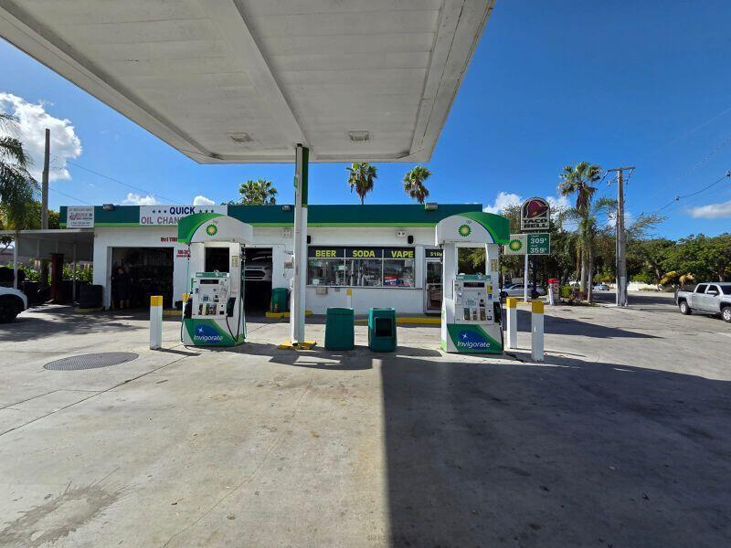 A BP gas station with two fuel pumps and an attached service garage under a canopy — 3198 S Dixie Highway, Miami FL 33133, MIAMI, FL