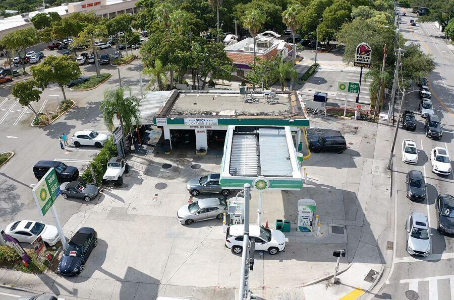 An aerial view shows a BP gas station and oil change facility with surrounding parking — 3198 S Dixie Highway, Miami FL 33133, MIAMI, FL