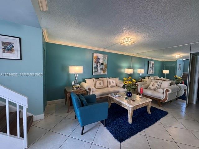 A two-story stucco house features a brick walkway, a paved driveway, and palm trees — 635 NW 97th Pl, Miami FL 33172, MIAMI, FL