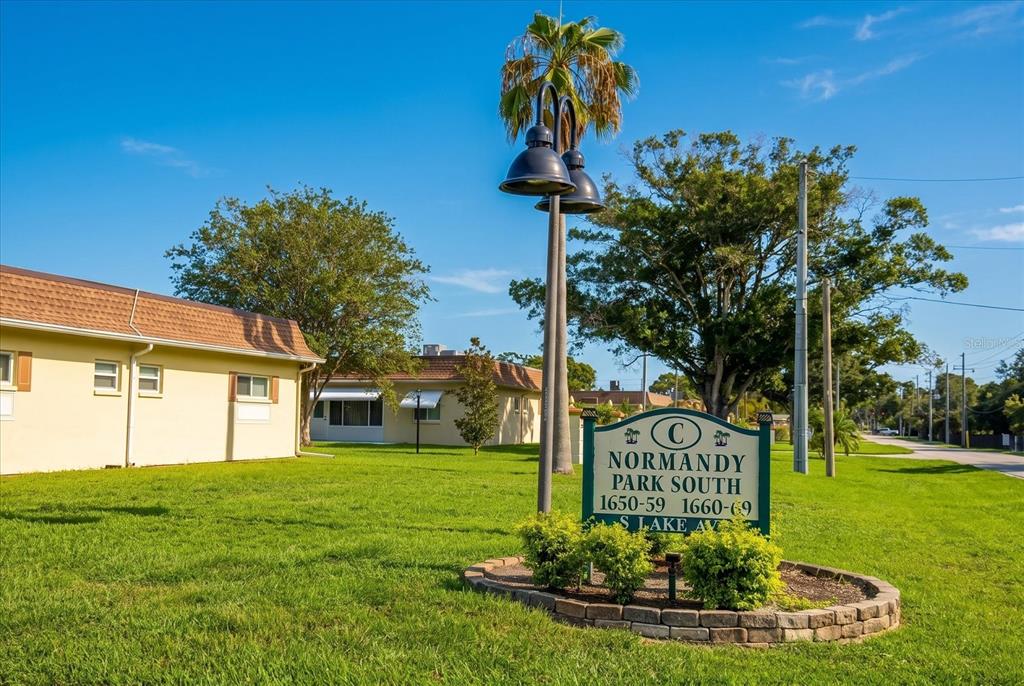 A sign for Normandy Park South stands on a lawn in front of residential buildings — 1651 S LAKE AVENUE UNIT 3, CLEARWATER, FL