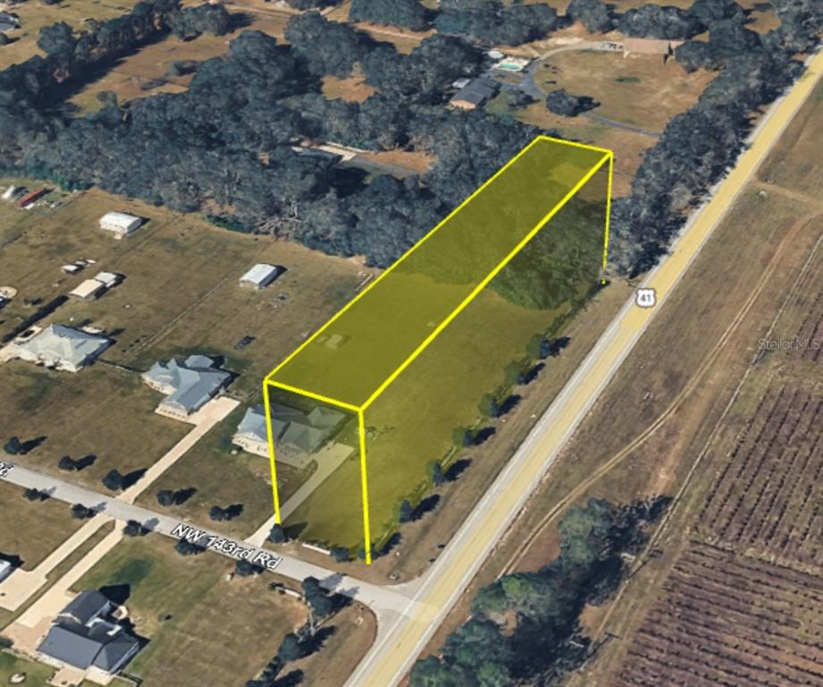 An aerial view shows a rectangular plot of land highlighted in yellow along a road — 0 NW 143RD ROAD, HIGH SPRINGS, FL