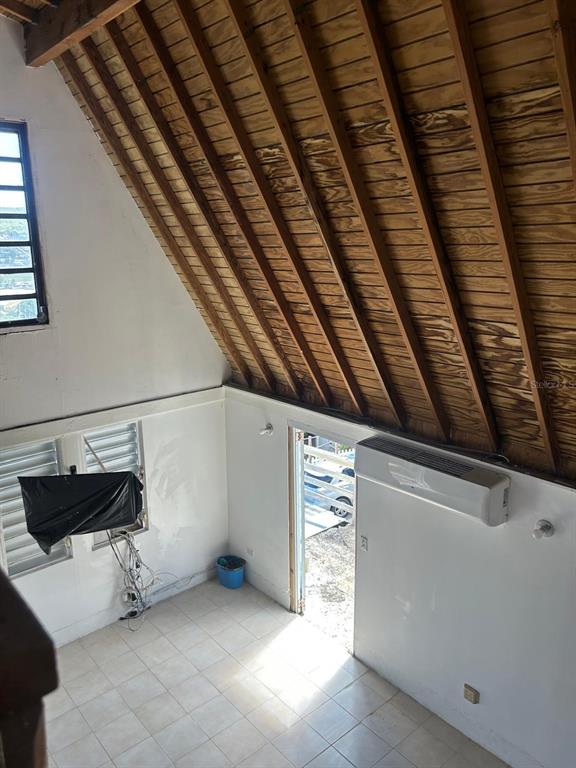 An interior view of a room with a vaulted wood-paneled ceiling and tiled flooring — Catalina Ortis CATALINA ORTIZ UNIT 108, CULEBRA, PR