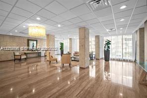 A spacious lobby features polished stone floors, a drop ceiling, and several seating areas — 1950 S Ocean Dr # 4D, Hallandale Beach FL 33009, HALLANDALE BEACH, FL