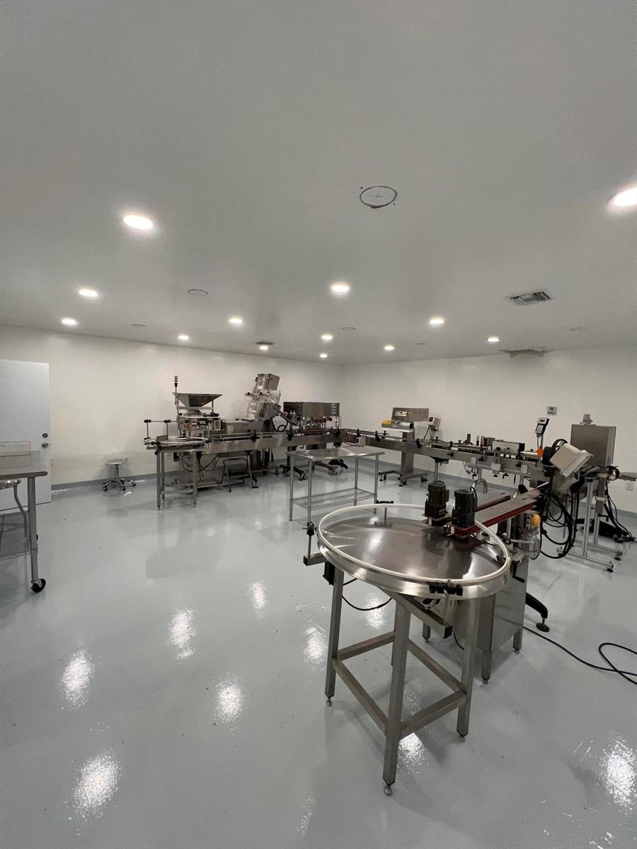 A clean, industrial production room features stainless steel machinery, white walls, and a glossy floor — 3335 NW 74th Avenue # 3335, Miami FL 33122, MIAMI, FL