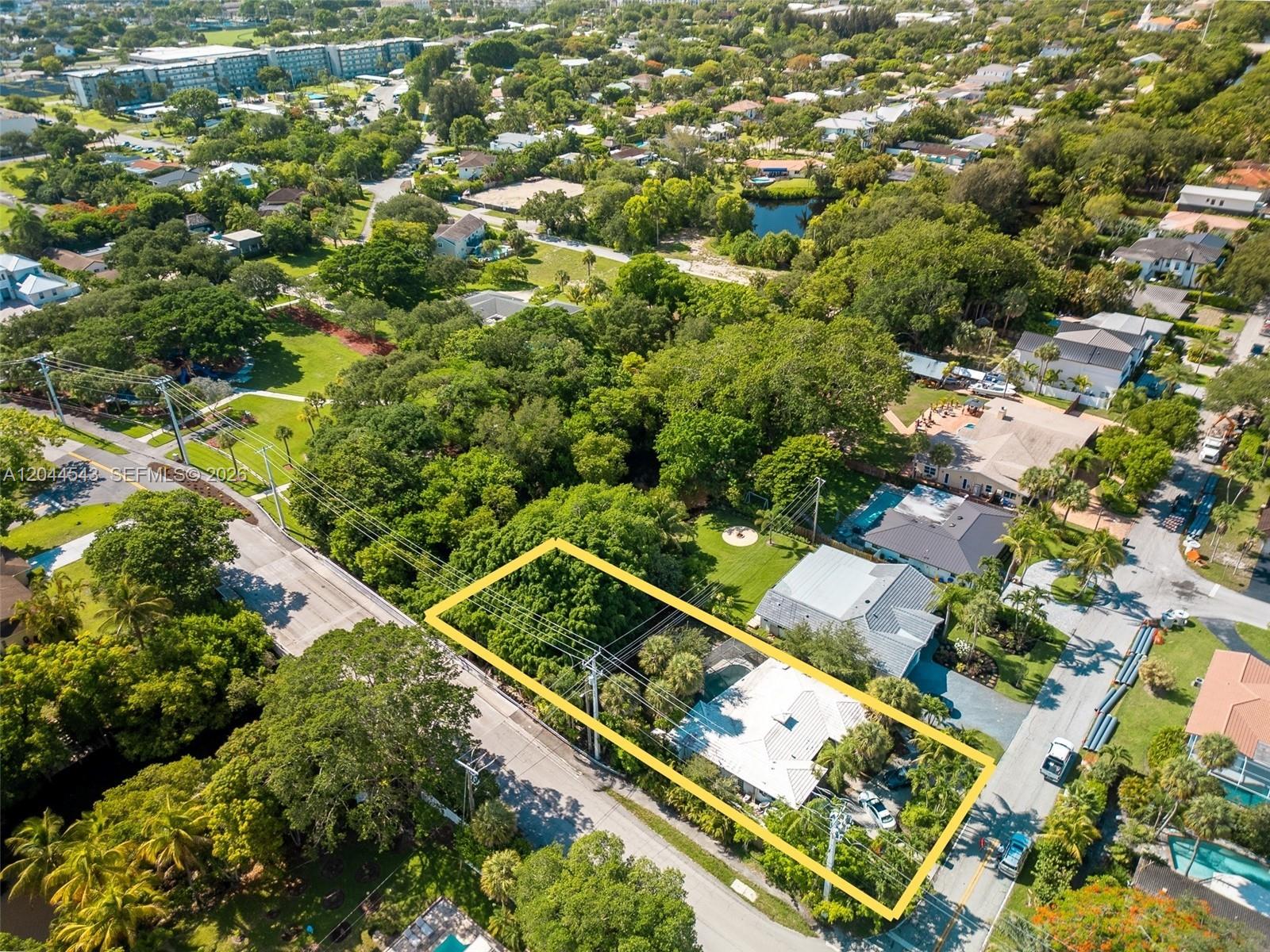 An aerial view shows a residential property outlined in yellow, surrounded by lush green trees — 698 NW 7th Ave, Boca Raton FL 33486, BOCA RATON, FL