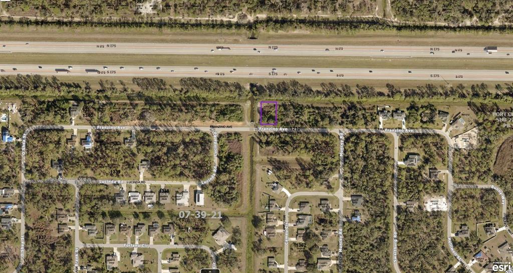 This is an aerial map showing a vacant lot highlighted in purple near a highway — 0950121001 FRANZINO AVENUE, NORTH PORT, FL