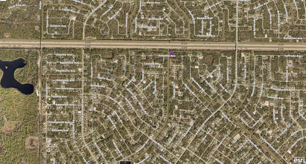 This is an aerial map view of a residential neighborhood bisected by a highway — 0950121001 FRANZINO AVENUE, NORTH PORT, FL