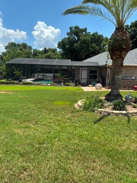 A foyer with hardwood floors, a white front door with glass inserts, and an arched entryway — 537 WOODLAWN CEMETERY ROAD, GOTHA, FL